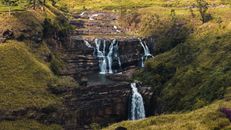 Waterfalls in the Middle of Green and Brown Mountains