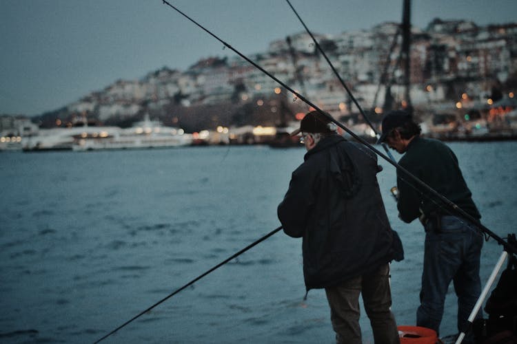 Men Fishing From The Pier 