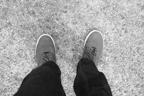 Free Grayscale Photo of a Person's Shoes  Stock Photo