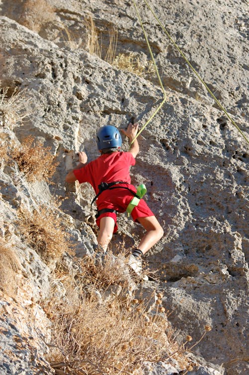 Person Rock Climbing