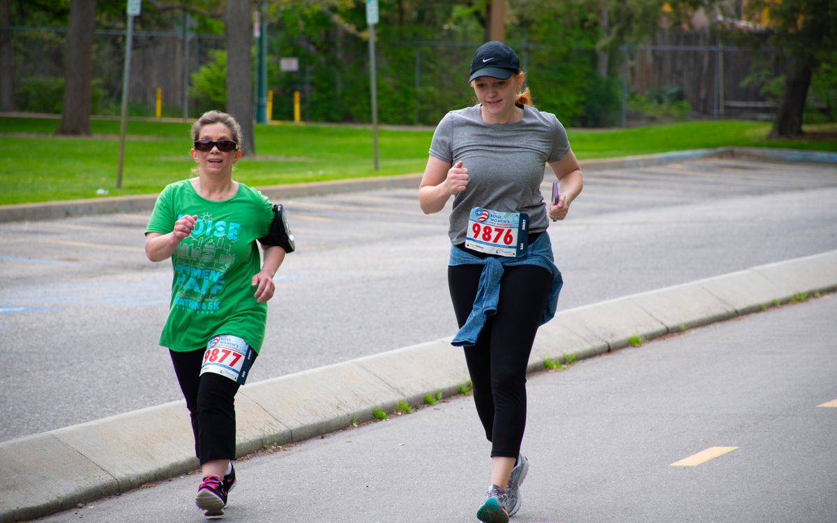 Two women running a local race