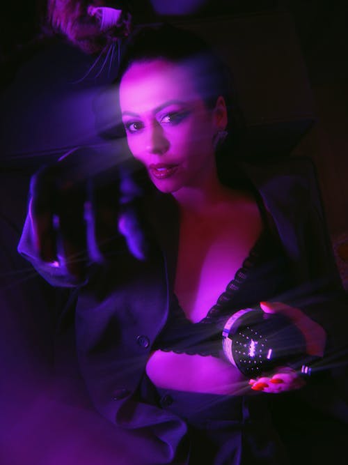 Purple Toned Image of a Woman Wearing Black Bra