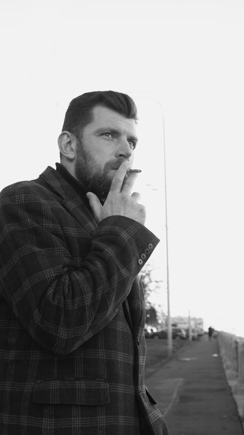 Free Grayscale Photo of a Man Smoking  Stock Photo