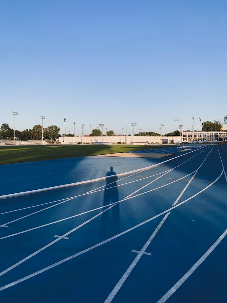 Shadow Of A Person On Track And Field