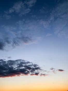 Vibrant sunset with pastel clouds creating a peaceful sky scene.