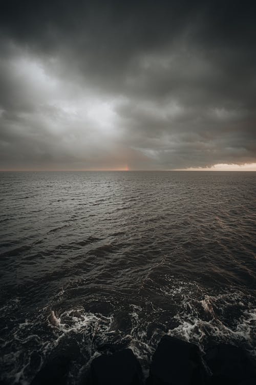 Free Body of Water Under Cloudy Sky Stock Photo
