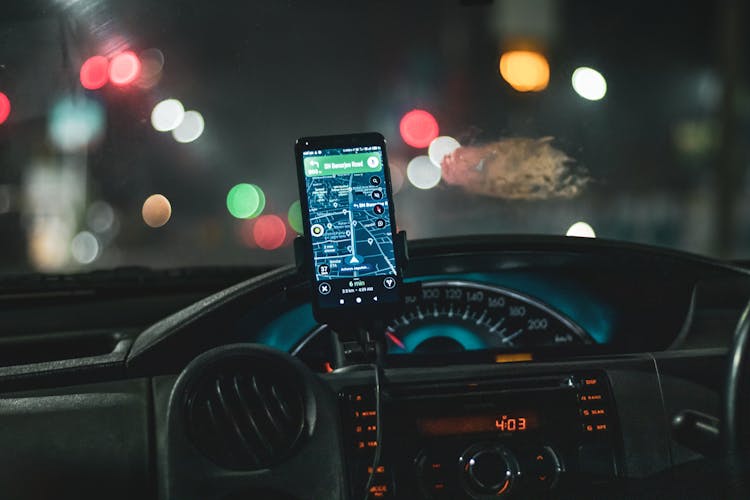 Black Smartphone On Car Holder Dashboard