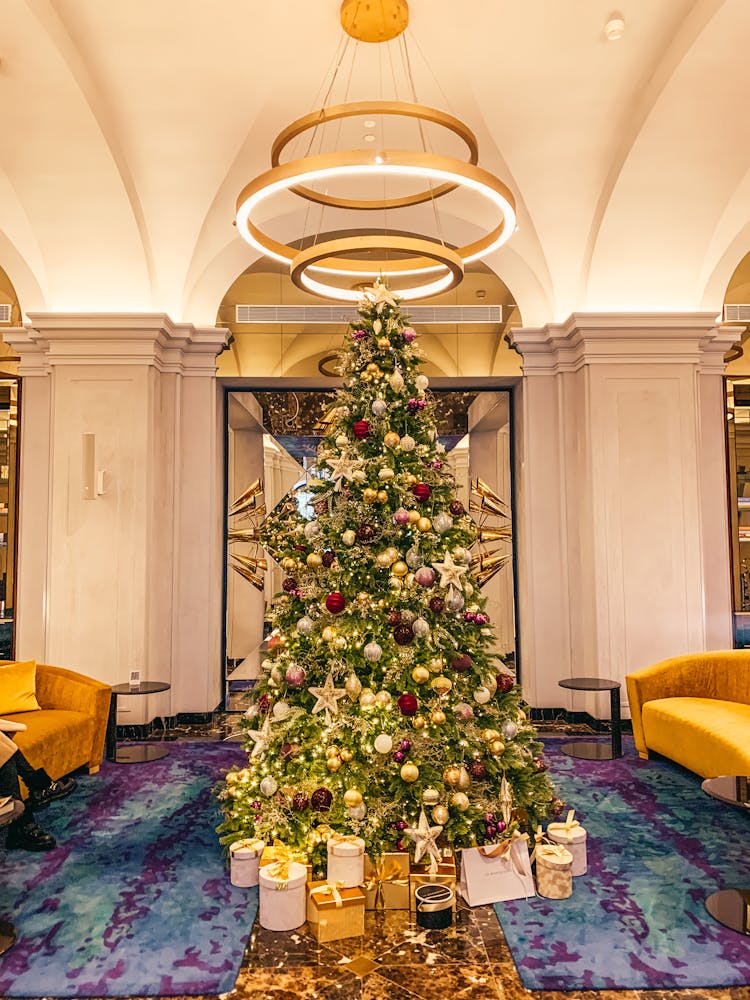 Illuminated Christmas Tree In Hotel Lobby