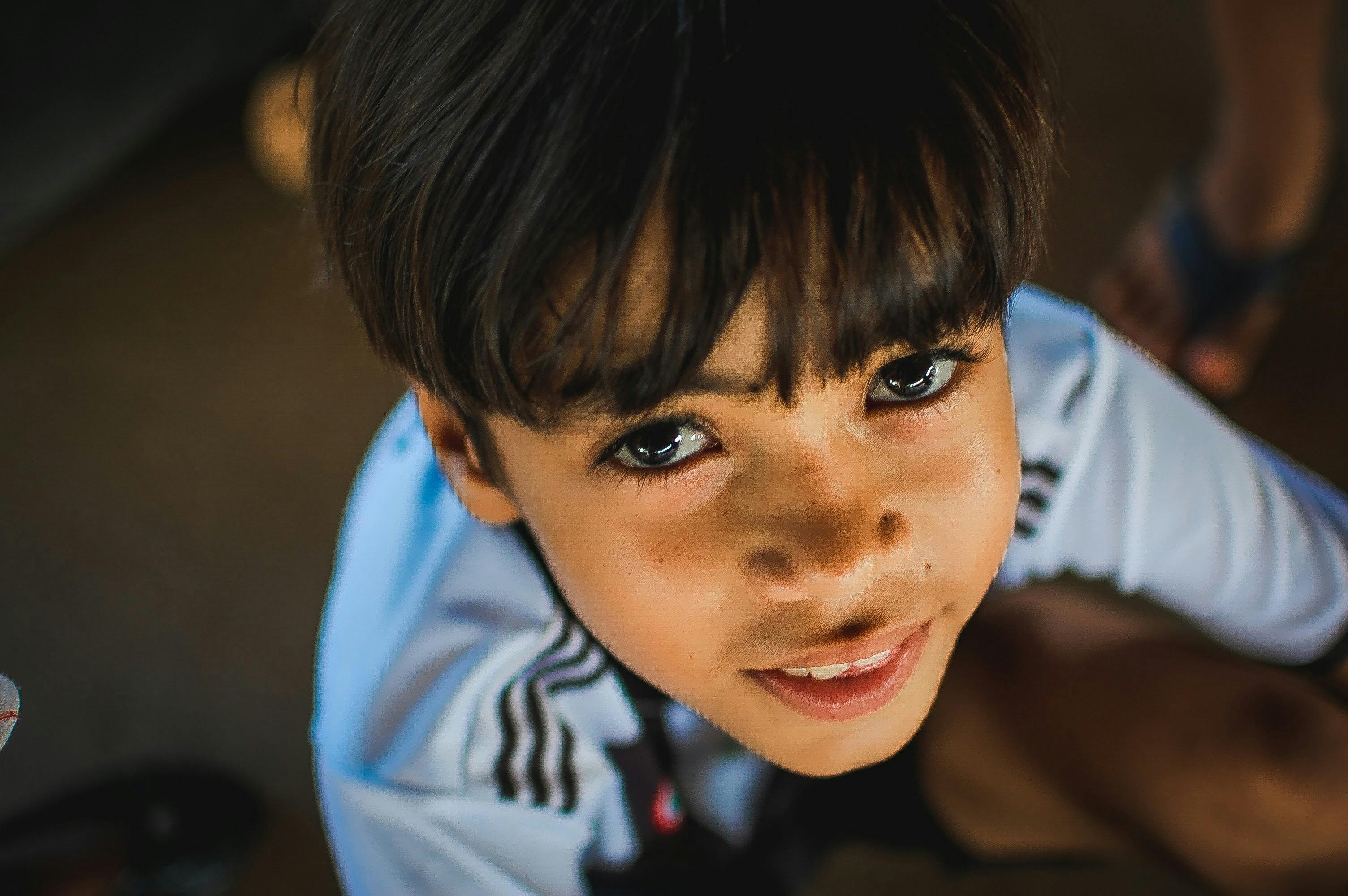 a close up shot of boy s face