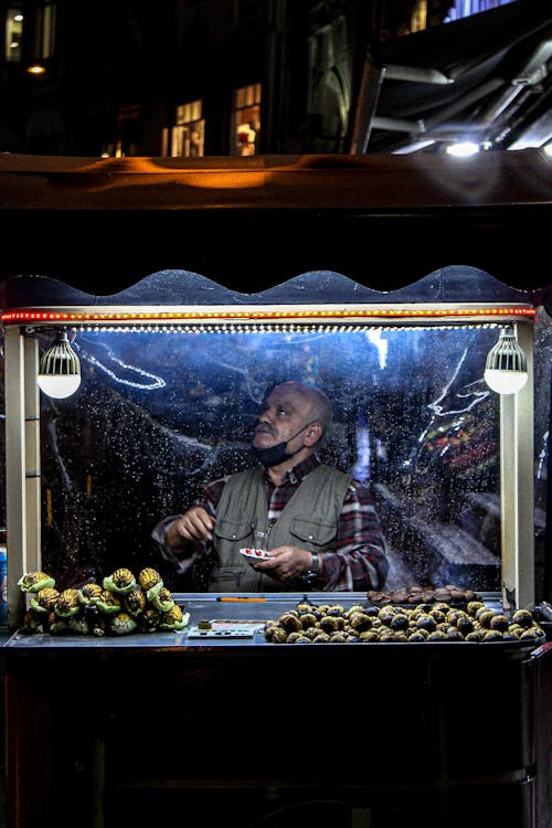 Free 
A Street Vendor at Night Stock Photo