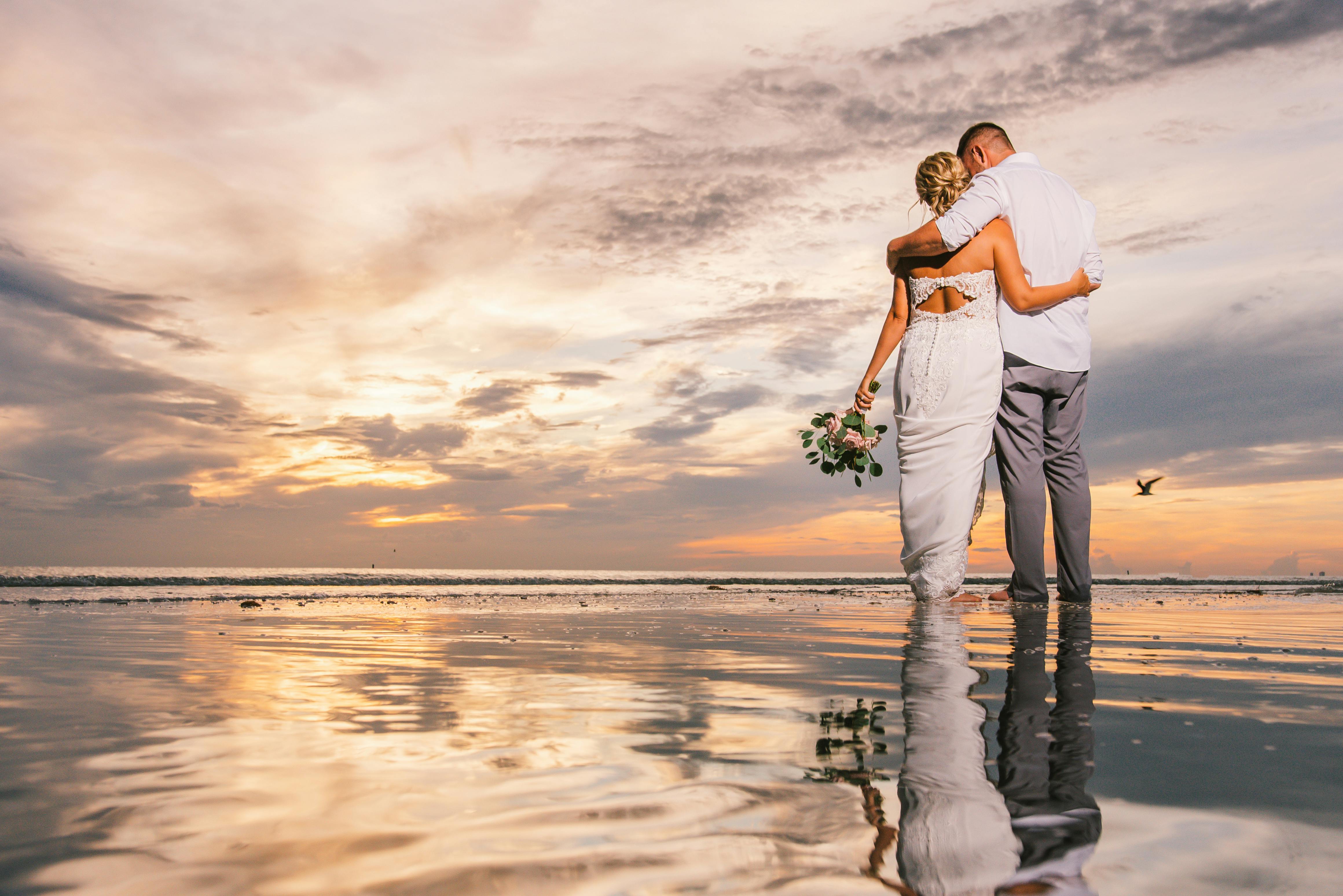 A Couple Hugging On A Beach · Free Stock Photo