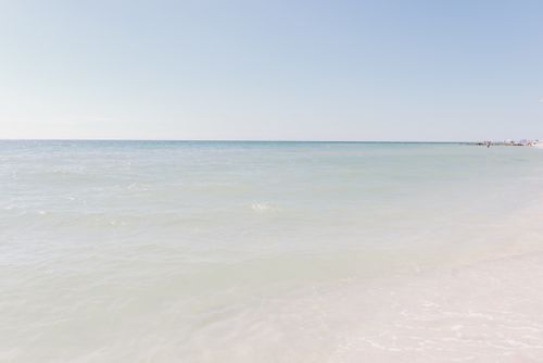 Free Peaceful sea view with blue sky and calm waters at a serene coastal location. Stock Photo