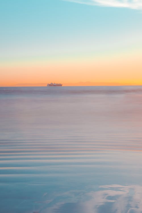 Iridescent Seascape with a Ship on Horizon