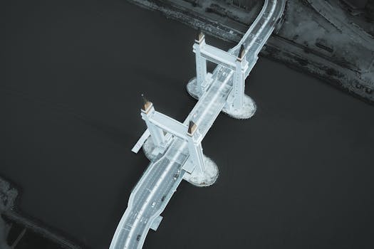 Captivating aerial view of the iconic Kuala Terengganu Drawbridge over a river in Malaysia.