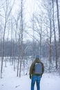 Person in Black Jacket Standing on Snow Covered Ground