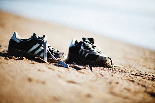 Sneakers on Brown Sand 