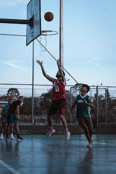 Engaging outdoor basketball match in Curitiba with players in action, capturing a spectacular shot.