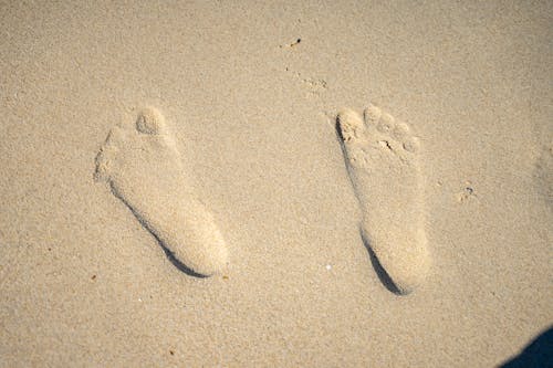 Free Close-Up Shot of Footprints on Sand Stock Photo