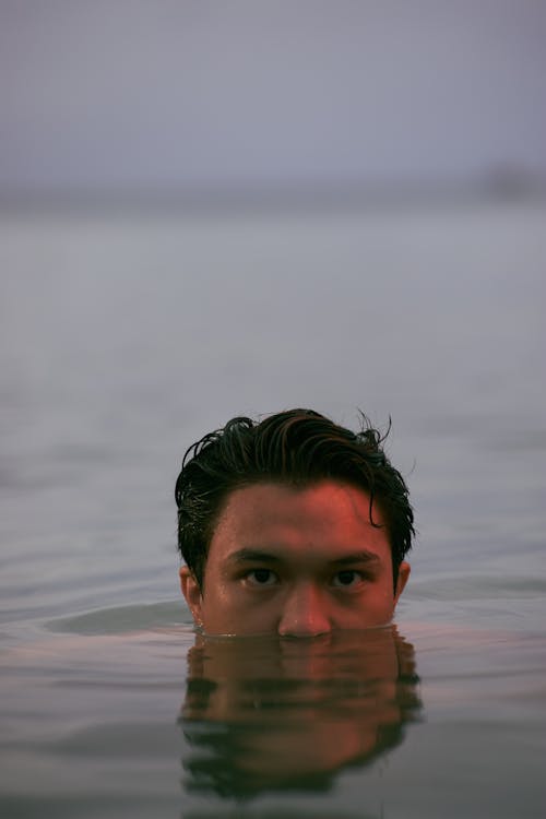 Closeup of a Man Swimming in a Lake