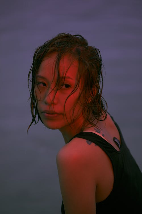 Woman with Wet Hair Wearing Black Tank Top