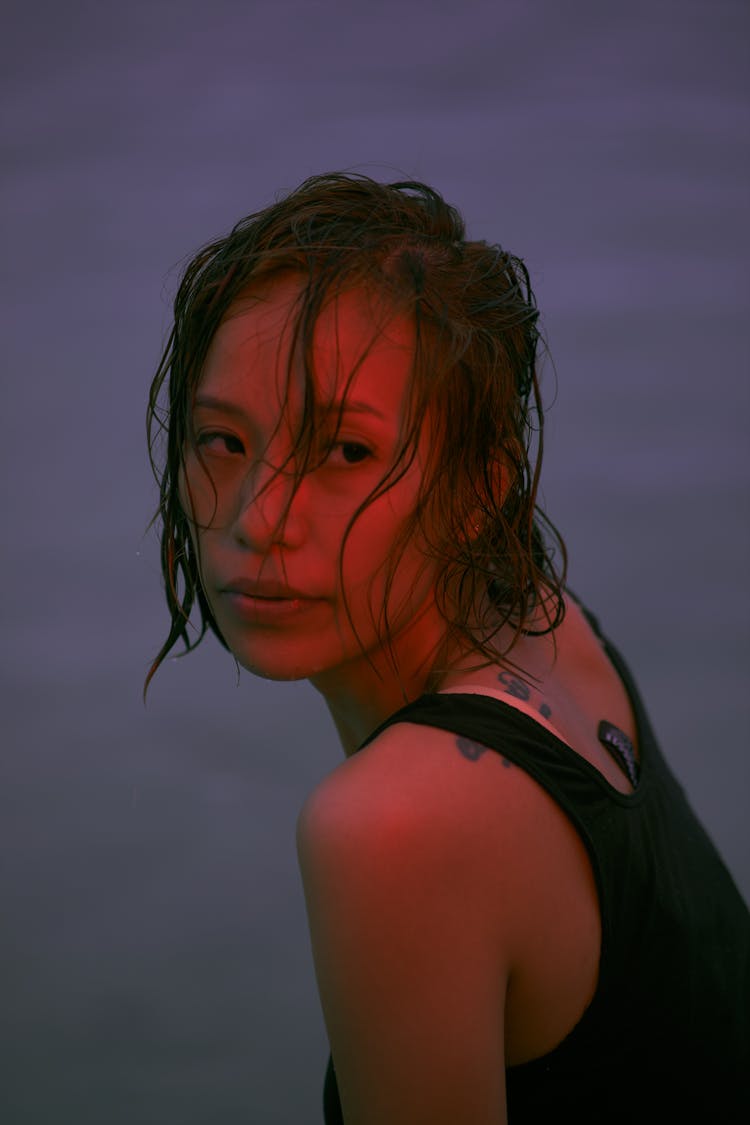 Woman With Wet Hair Wearing Black Tank Top