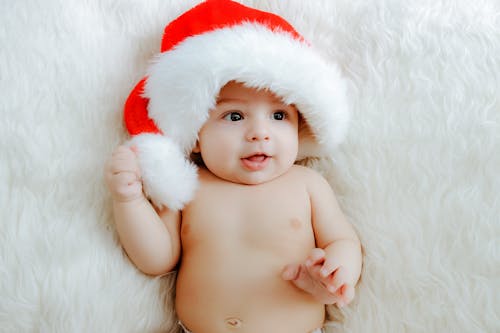 Free Close-Up Shot of a Baby Wearing Christmas Hat Stock Photo