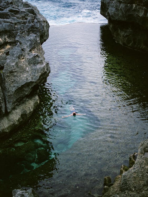 Free Person Floating in the Ocean Stock Photo