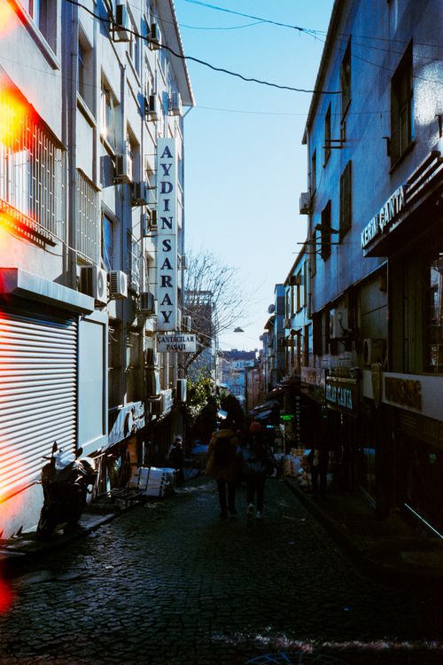 Free A bustling street scene in Istanbul featuring buildings and the Aydın Saray sign. Stock Photo