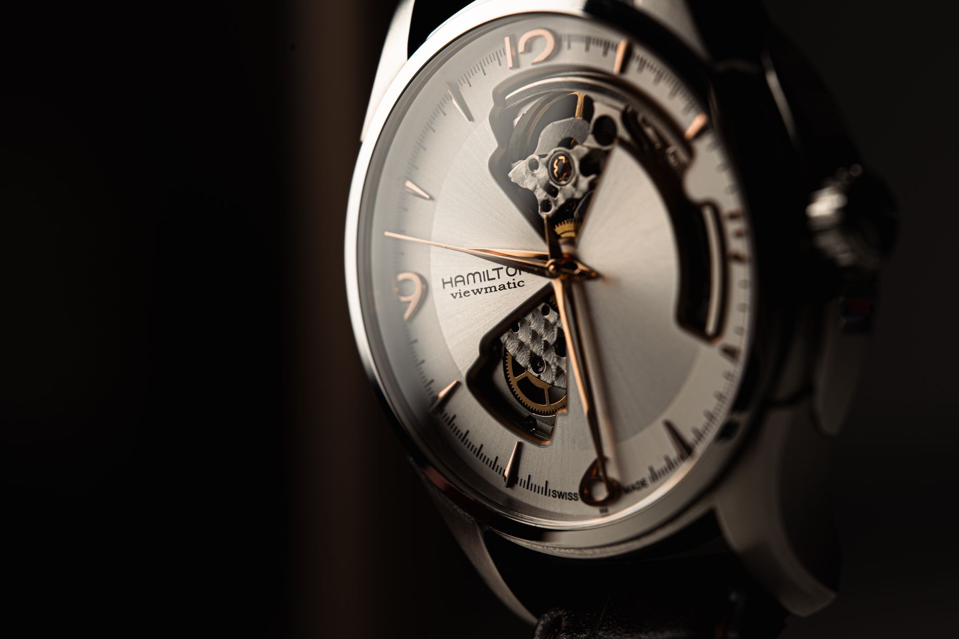 A detailed close-up of a luxury wristwatch showcasing sophisticated craftsmanship and mechanical design.
