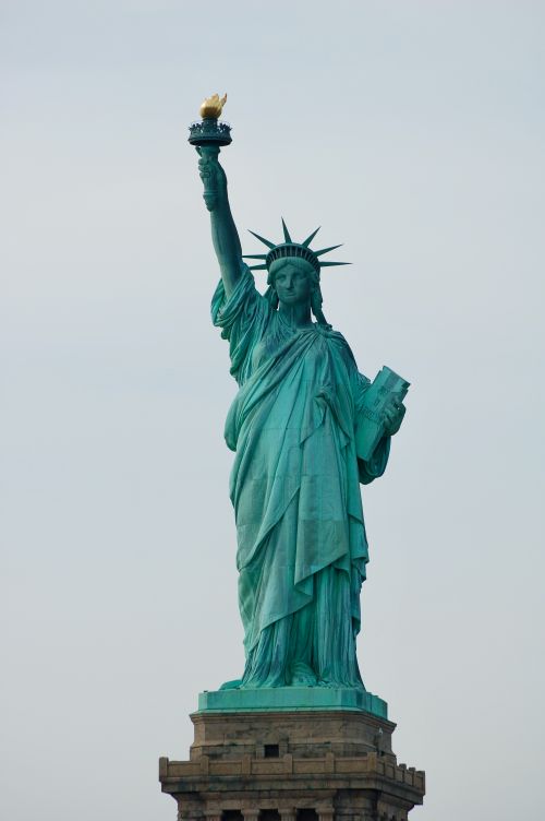 Free Iconic Statue of Liberty in New York City symbolizing freedom and democracy. Stock Photo