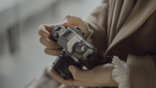 
A Close-Up Shot of a Person Holding a Camera