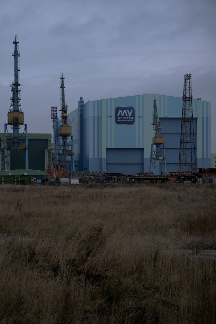 Factory Facility Building At Dusk 