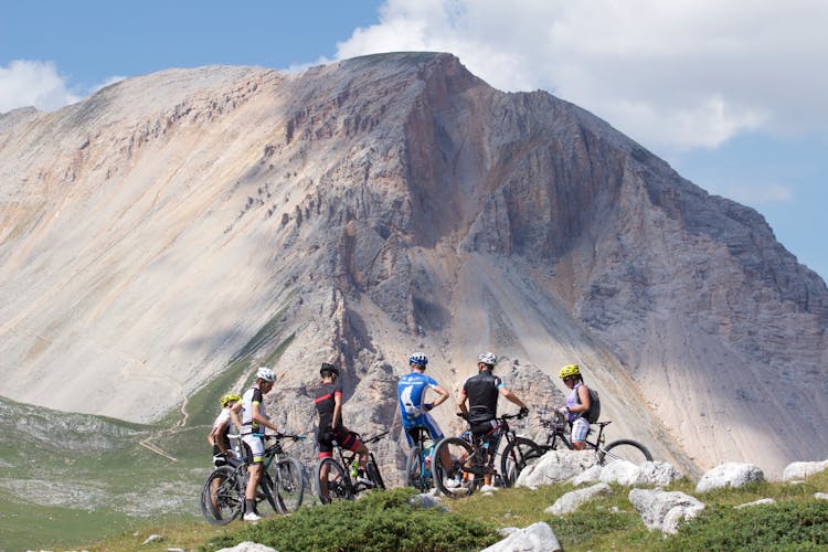 Group Of Mountain Bikers Parked Near The Mountains