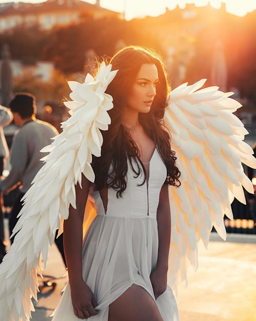 A Beautiful Woman in White Dress with Angel Wings