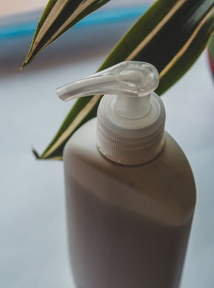 Lotion In A Pump Bottle In Close-Up Photography