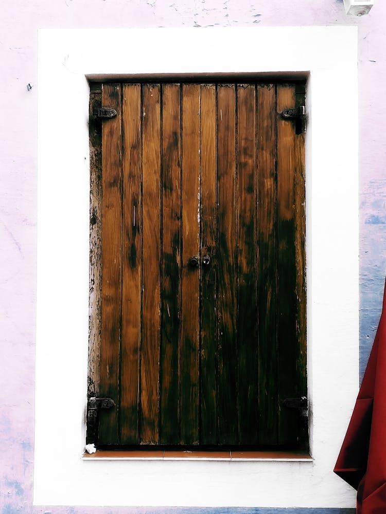 Closed Wooden Shutters On A Window