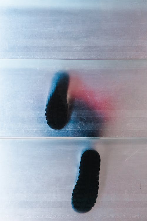 A Person Stepping on a Translucent Glass Floor