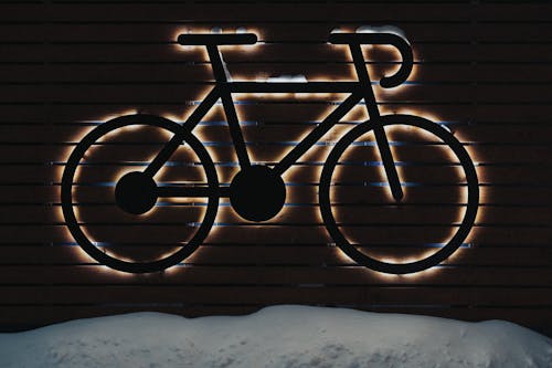 Illuminated Signage on Wooden Wall