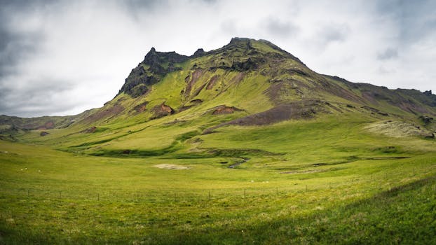 A stunning view of a green mountain landscape in Iceland, capturing nature's beauty.