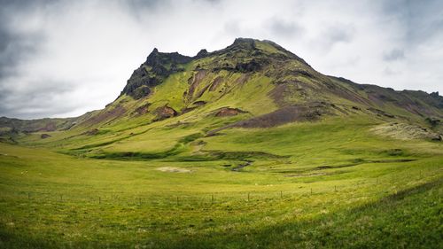 Free A stunning view of a green mountain landscape in Iceland, capturing nature's beauty. Stock Photo