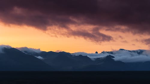 Foto profissional grátis de alvorecer, cair da noite, céu alaranjado