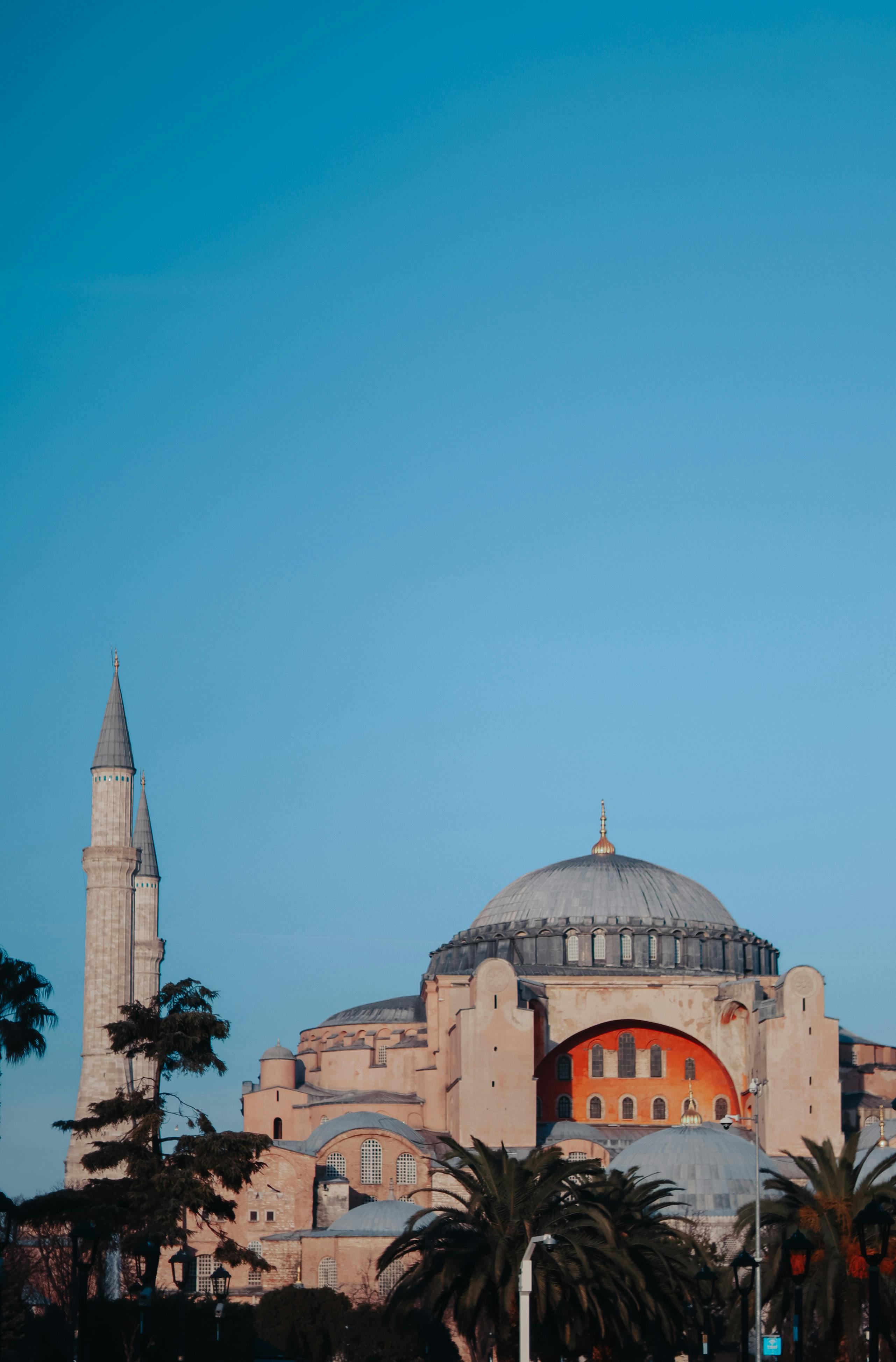 Stunning view of the Hagia Sophia Mosque and its minarets against a clear blue sky in Istanbul.