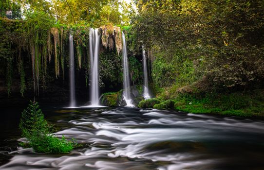 Experience the serene beauty of Duden Waterfalls surrounded by lush greenery in Antalya, Turkey.