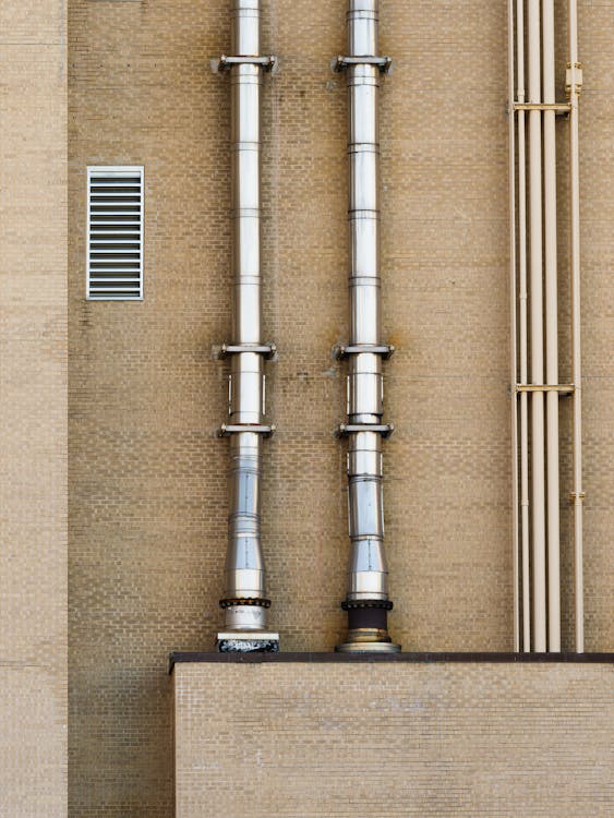 Stainless Pipes on Exterior Wall of a Building