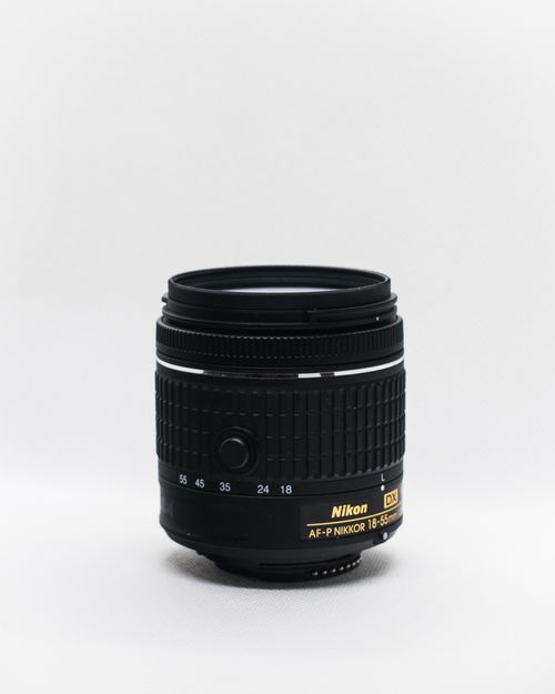 Free Detailed close-up of a Nikon DX lens against a white background for photography use. Stock Photo