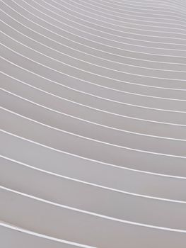 Minimalist capture of architectural lines forming a symmetrical pattern of curves.
