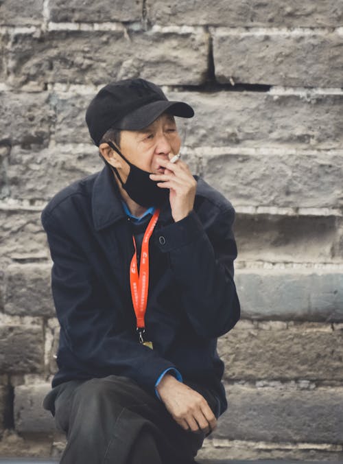 Elderly Man Smoking a Cigarette