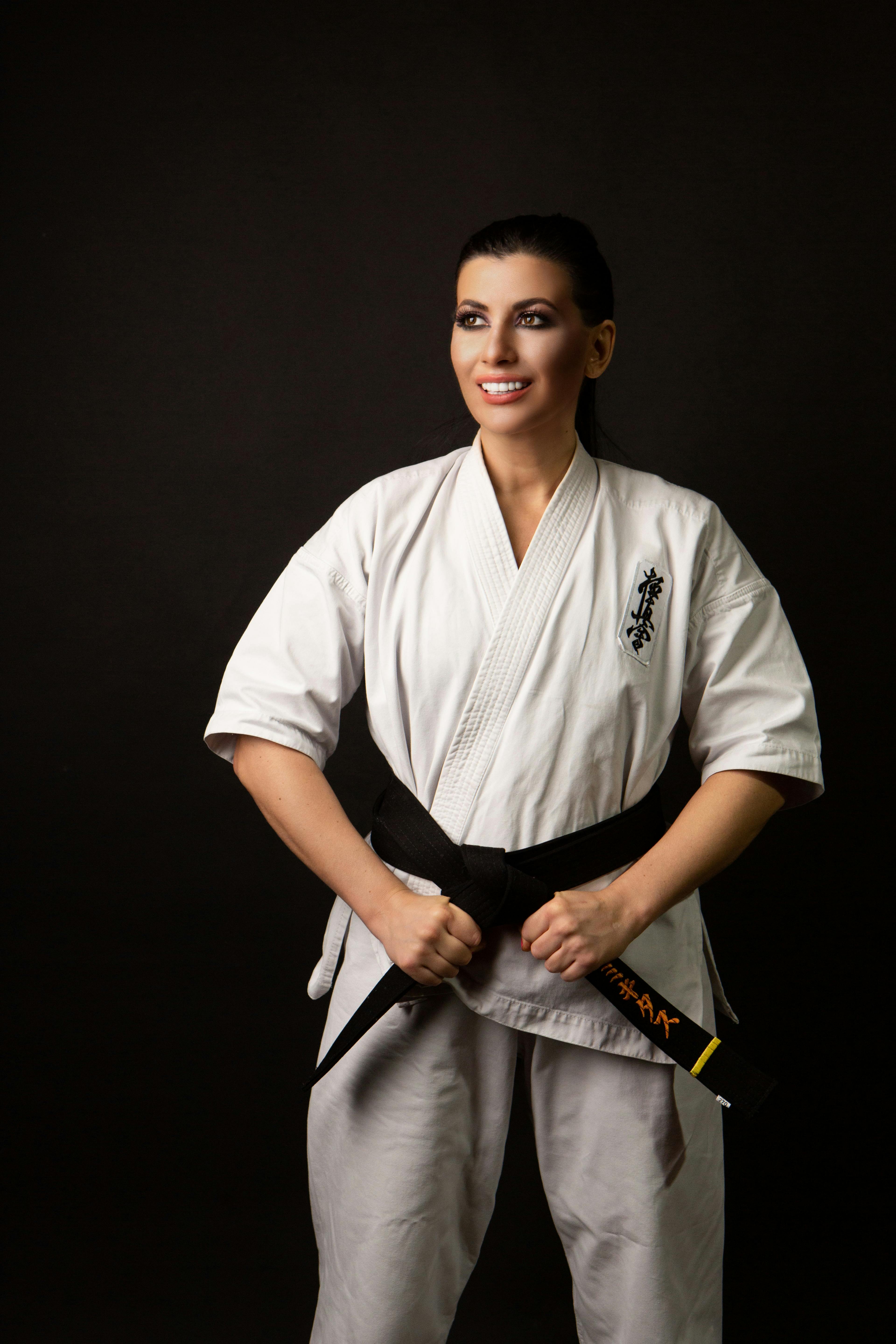 Woman in Karate Uniform on Black Background · Free Stock Photo