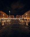 People Walking on Sidewalk Near Building during Night Time
