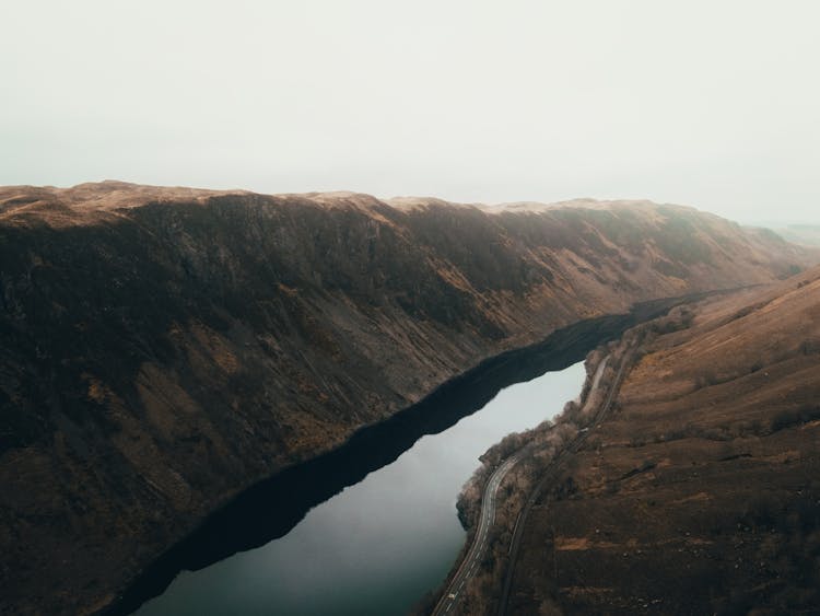 Barren Terrain In Fog And Canal 